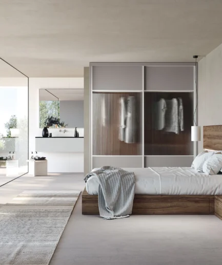 Dormitorio de matrimonio moderno con cabecero Gap, chifoniers y armario de puertas correderas interiores