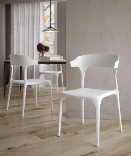 Silla Pisa blanca de polipropileno con diseño moderno apilable para interior y exterior.