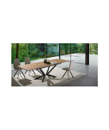 Mesa de comedor Motion extensible con estructura de acero, tapa en madera o vidrio y sistema de extensión lateral para mayor capacidad.