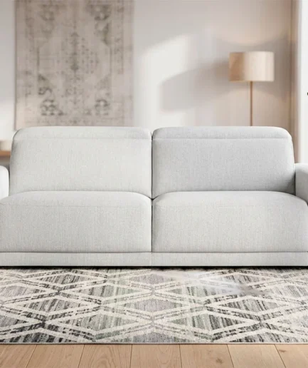 Sofá Sabba personalizable de Quality Sofás con chaise longue, cabezales reclinables y asientos deslizantes tapizado en tela.
