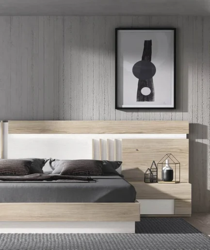 Dormitorio de matrimonio Vogue de Glicerio Chaves con cabecero moderno, dos mesitas de noche y bancada en estilo contemporáneo.